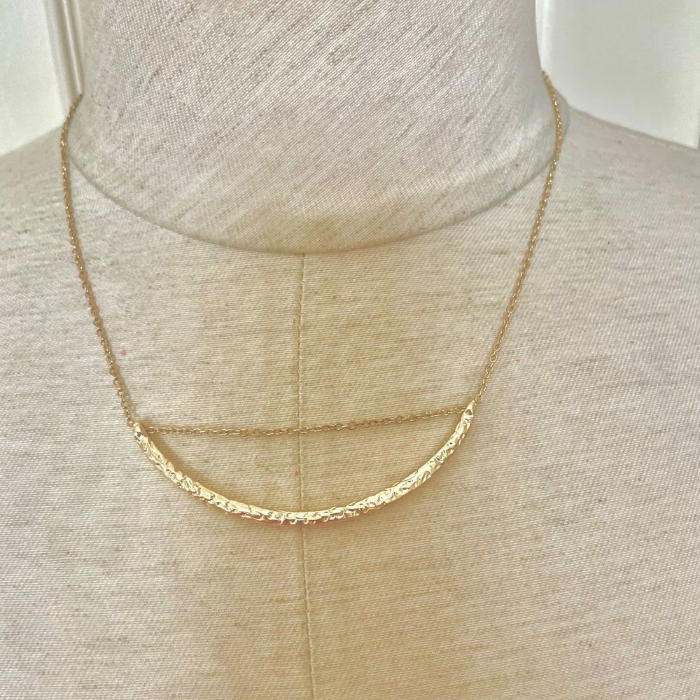 Gold tone pendant necklace